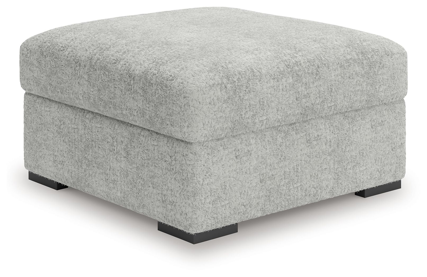 Light gray oversized accent ottoman with low black feet and squared profile