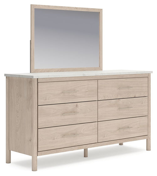 Cadmori two-tone dresser with mirror, light wood finish and four drawer fronts