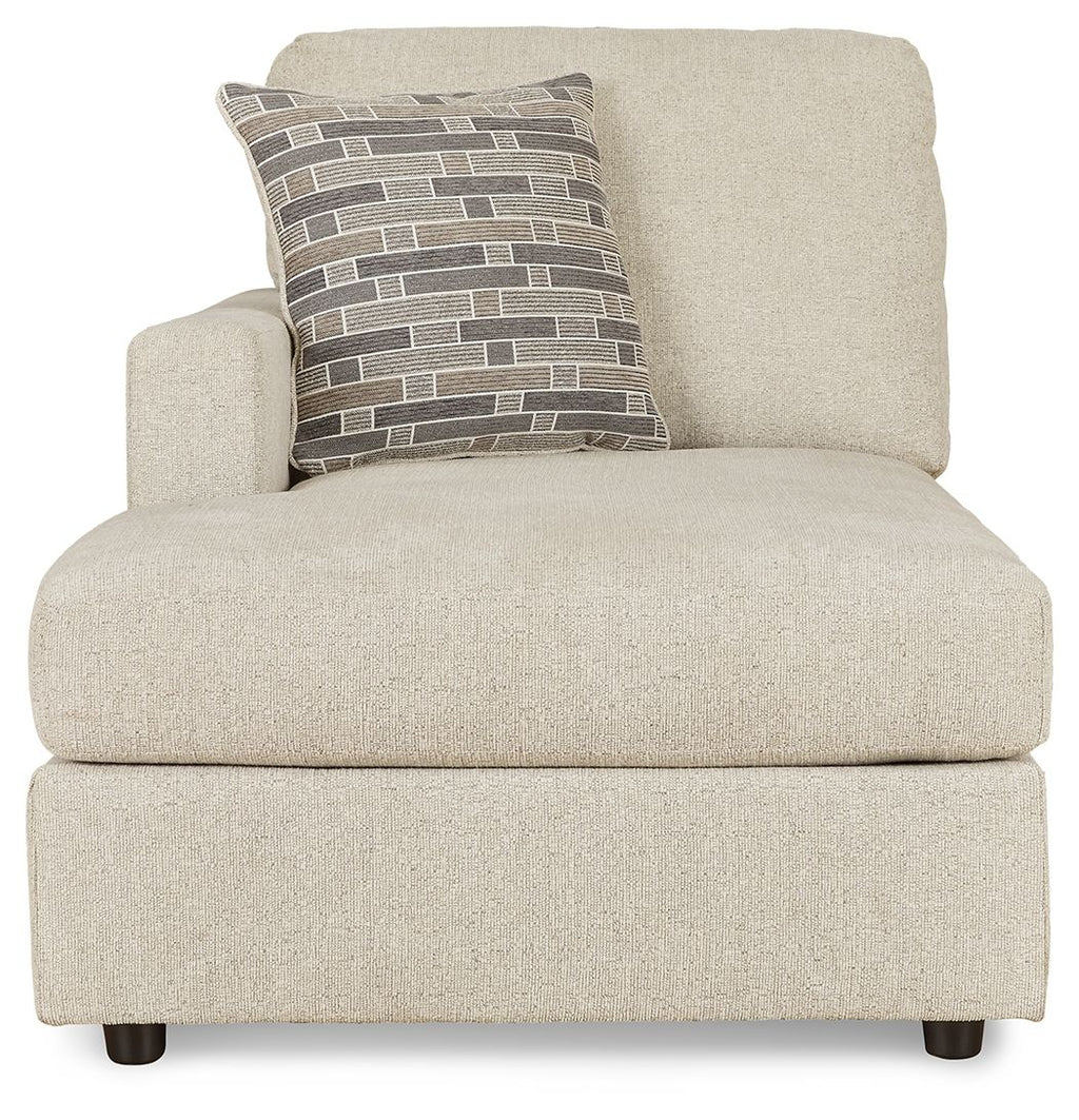 Pearl silver corner chaise with brick-pattern lumbar pillow and rounded arms