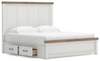 White storage bed with wood-trim headboard and two front pull-out drawers, close front view