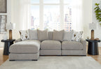 Light gray sectional sofa with extended chaise seats and patterned throw pillows