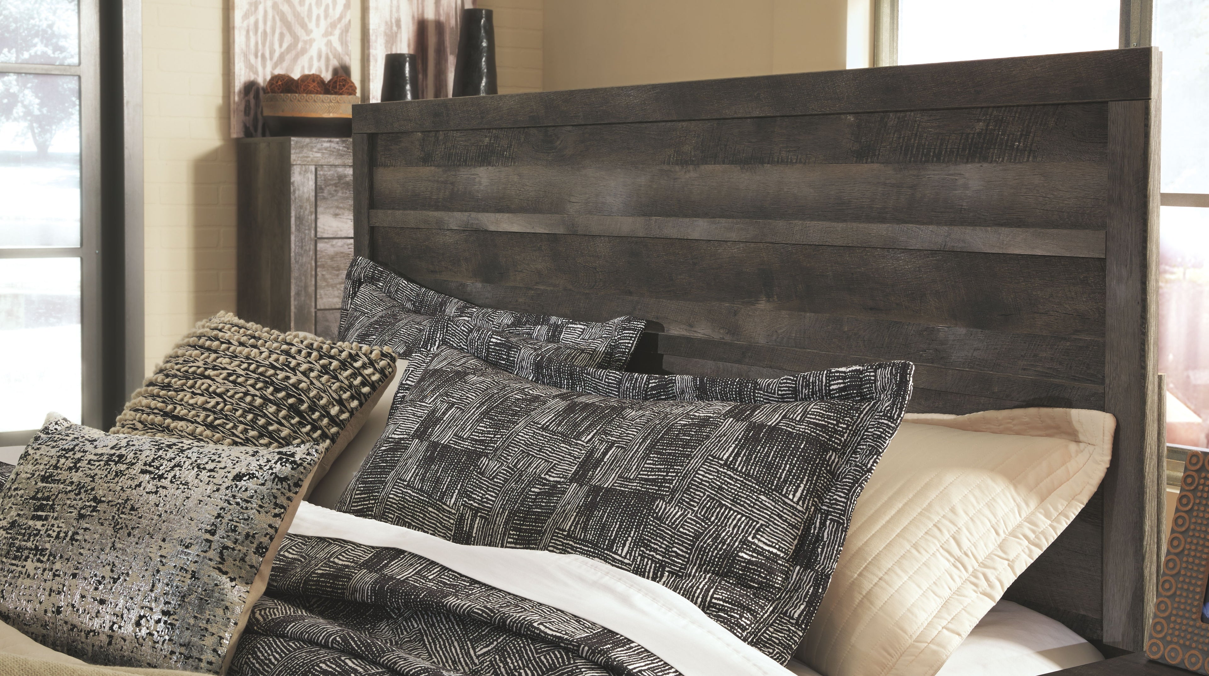 Panel bedroom set panel bed with dark wood headboard and gray patterned bedding