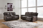 Boxmere dark brown power reclining sofa and loveseat with padded arms