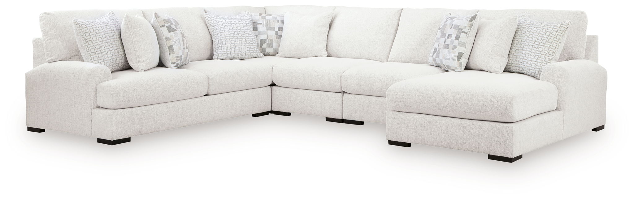 Light beige sectional sofa with chaise ends and patterned throw pillows