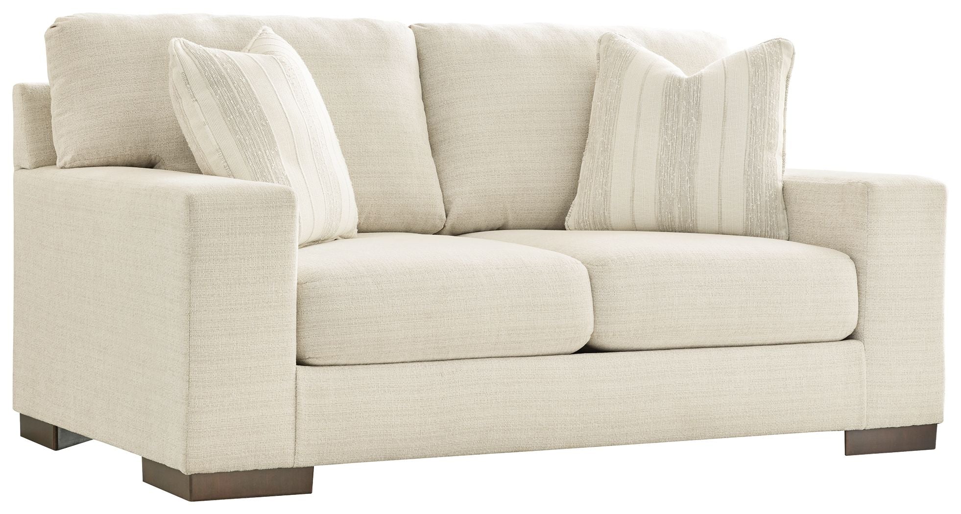 Cream loveseat with three stitched seat cushions and two striped throw pillows