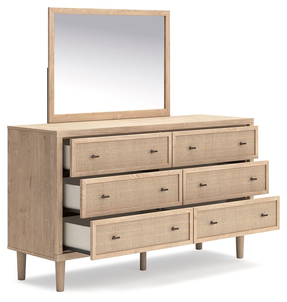 Two-tone dresser with mirror; angled view of stacked woven drawers and slim legs