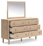 Two-tone dresser with mirror; angled view of stacked woven drawers and slim legs