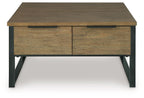 Light brown wood table with two doors/drawers on front, black metal legs