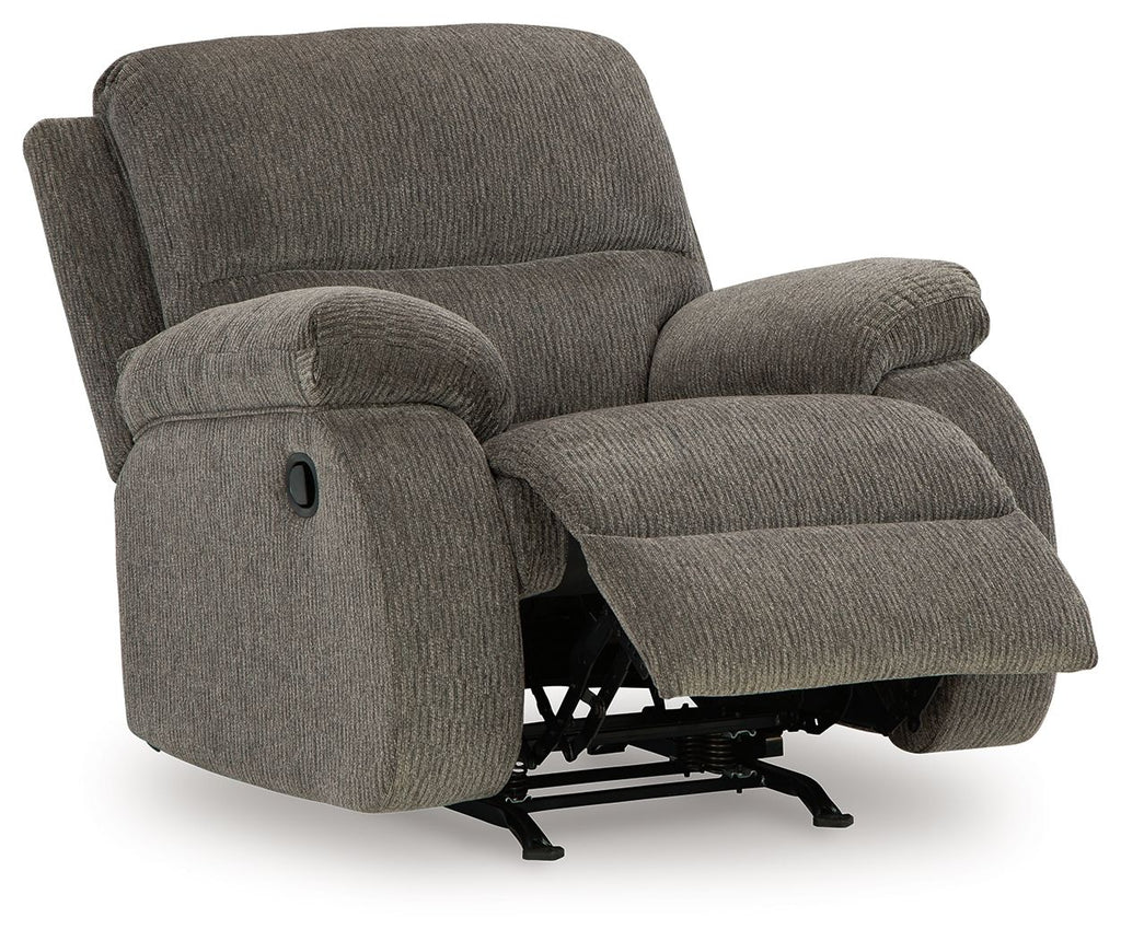 Dark gray rocker recliner chair with recline base visible beneath the seat