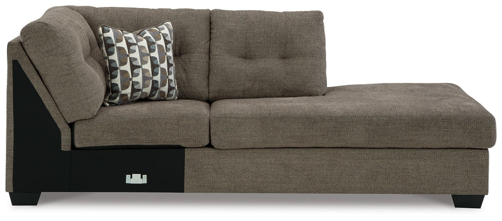 Chocolate-brown corner chaise sofa with tufted back, two-seat cushions, and patterned throw pillow