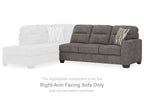 Right-arm facing graphite gray sofa section with striped pillow