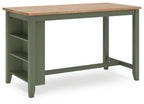 Rectangular dining table in green with open shelves under the tabletop.