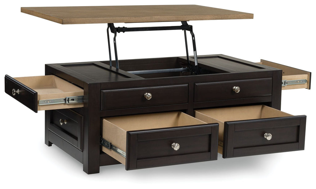 Lift-top cocktail table with raised lid, dark base, drawers, and pull-out compartments, knobs