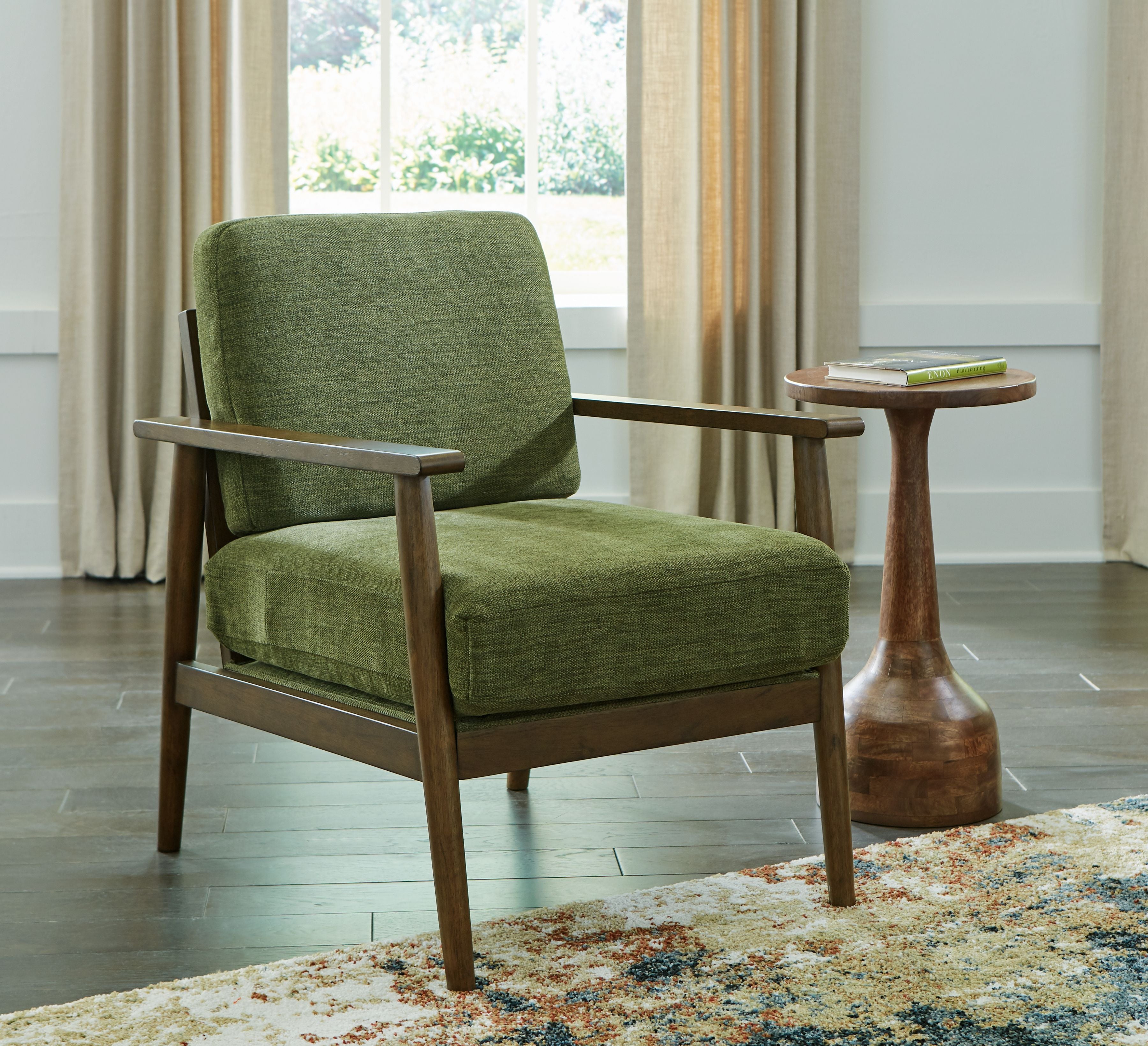 Green accent chair with upholstered seat and back, wood frame and arms