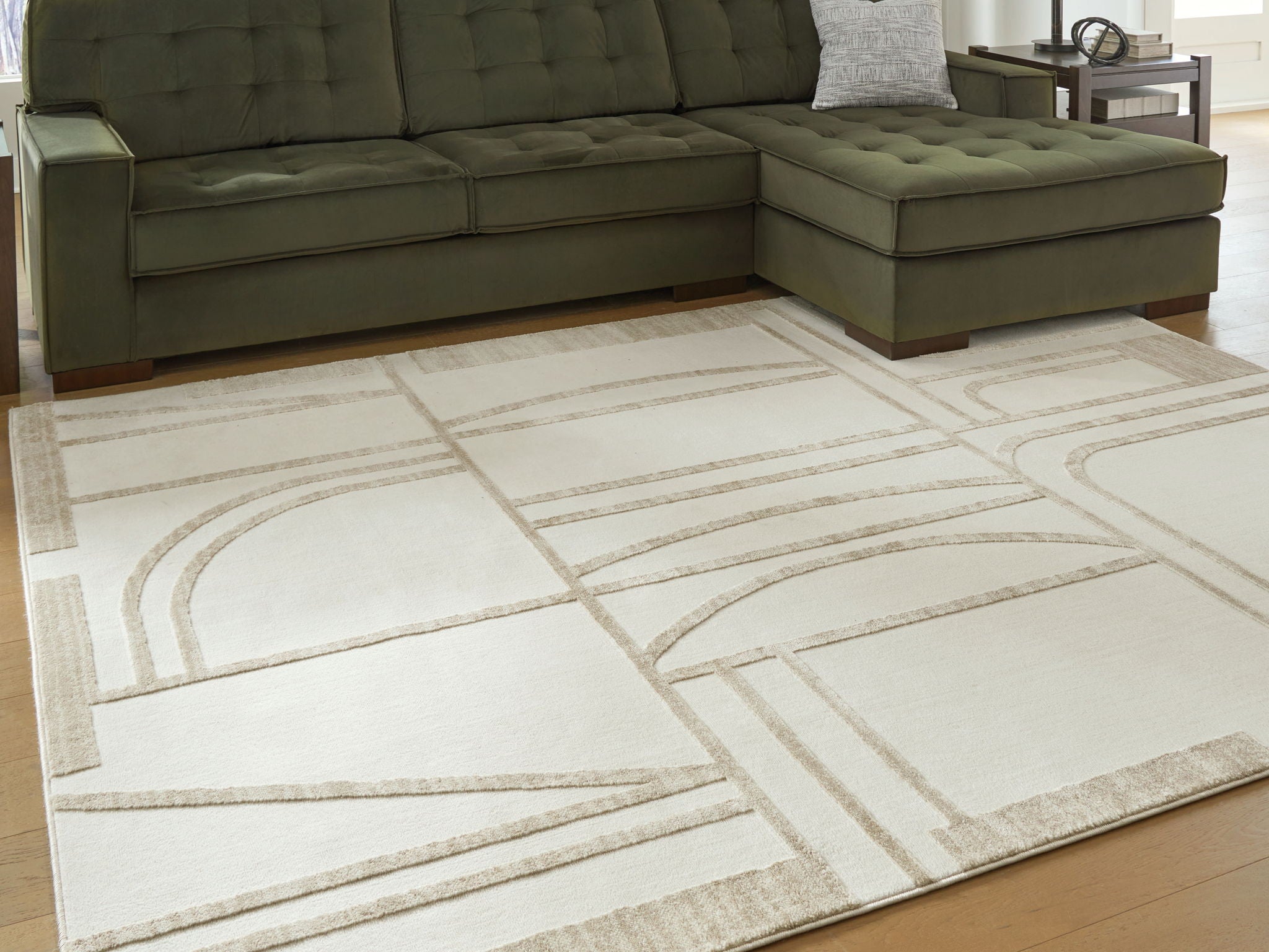 Beige area rug with linear geometric design in off-white and tan, flat weave