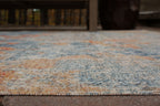 5' x 7' greige rug close-up of flat weave with speckled blue and orange pattern