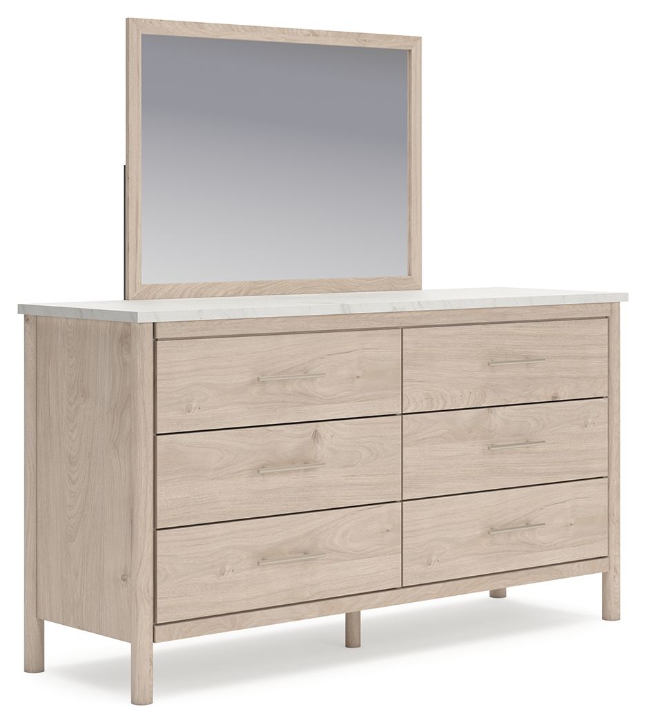 Light beige wood dresser with attached mirror and six drawers