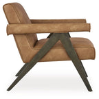 Tan accent chair side view with padded armrests, back seam, and dark base