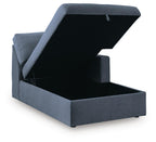 Ink blue corner chaise storage with lid open, upholstered interior