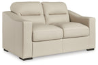 Almond loveseat with tufted back cushions, padded arms, and dark block feet