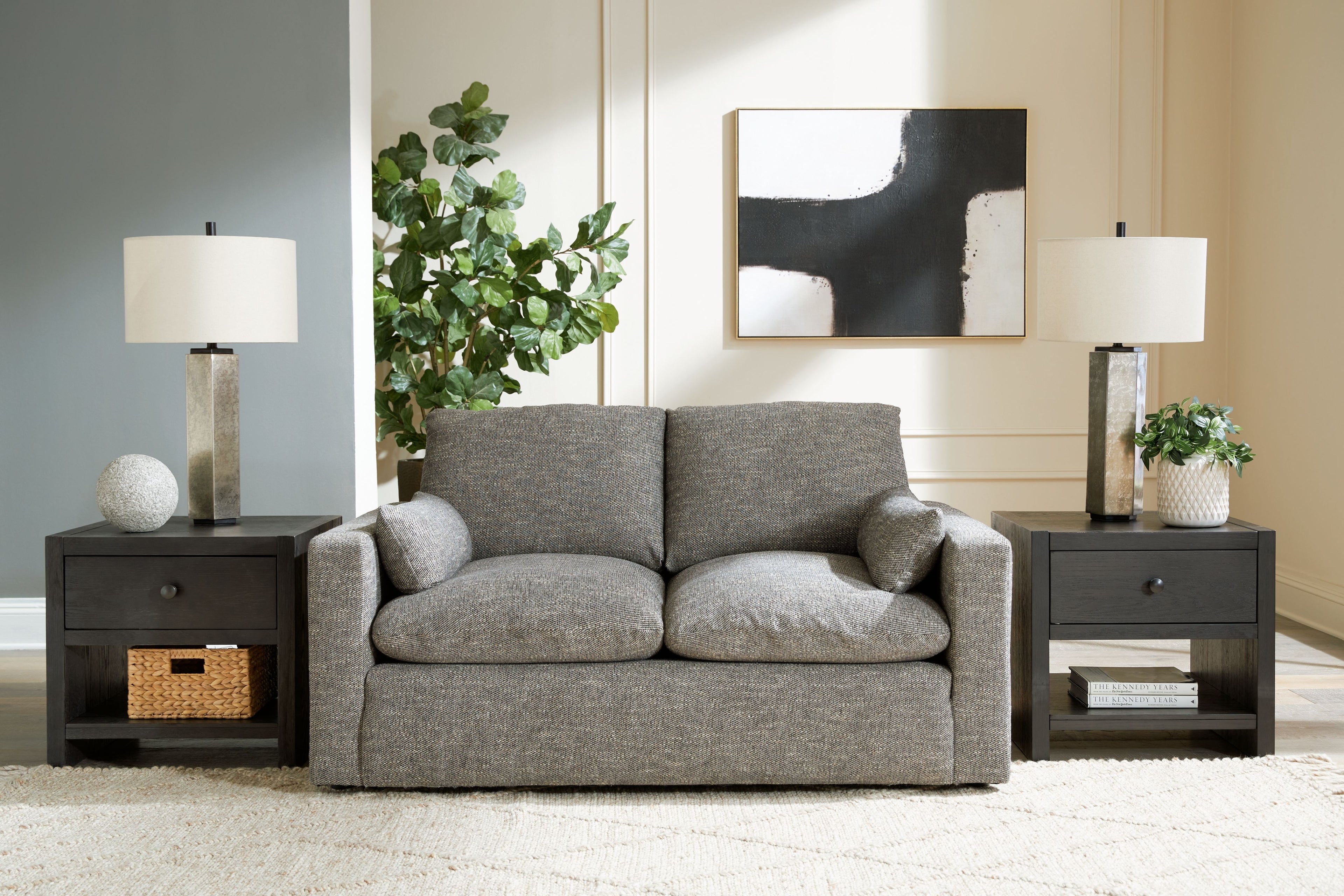 Granite upholstered loveseat with two back pillows and rolled arms