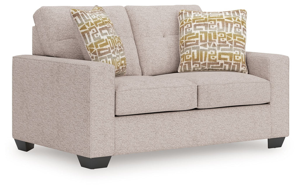 Gray upholstered loveseat with two square decorative pillows, gold and beige geometric pattern