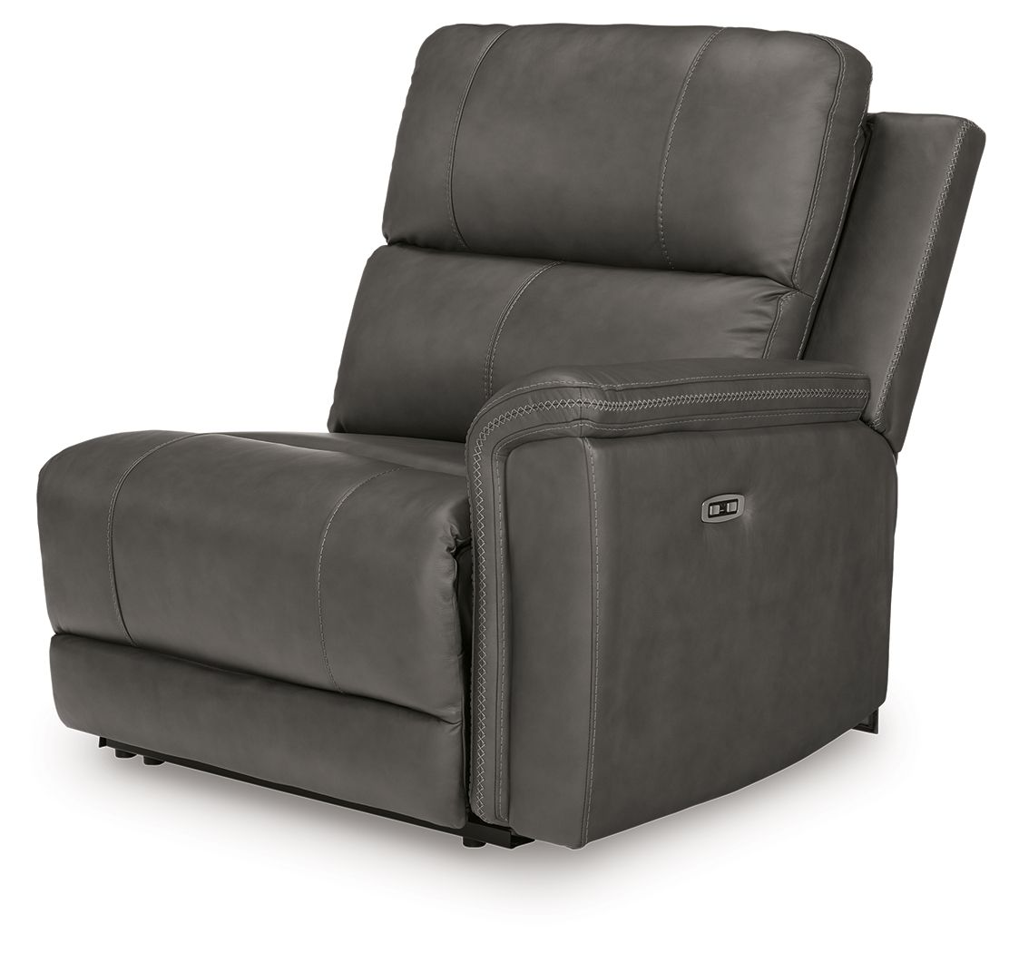 Power wall recliner chair in dark gray upholstery with padded headrest and armrests