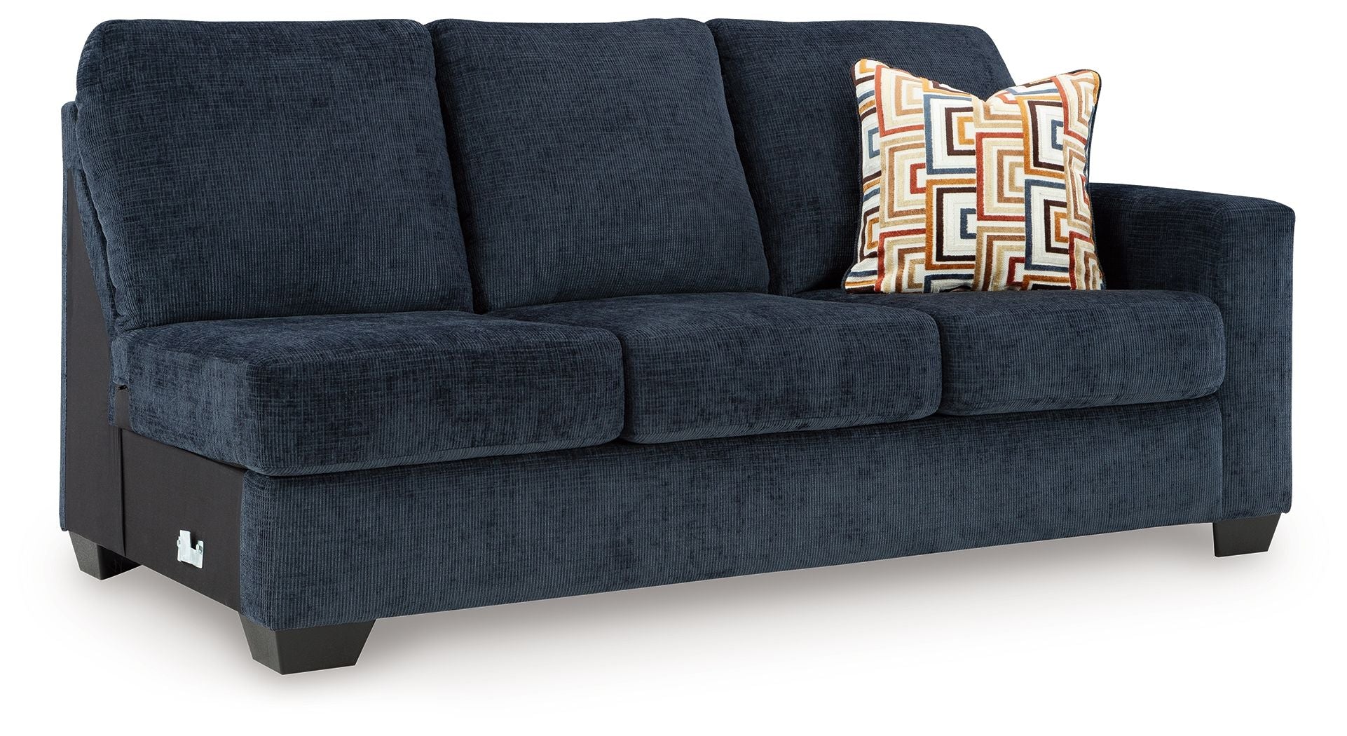 Ink blue fabric sofa with three seat cushions and patterned throw pillow