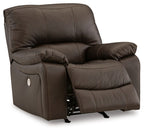 Dark brown rocker recliner chair, side view with recline mechanism and footrest