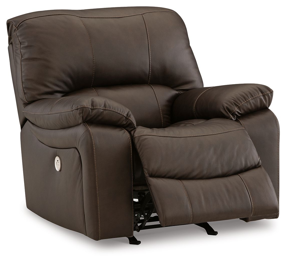 Dark brown rocker recliner chair, side view with recline mechanism and footrest