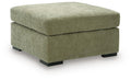 Oversized accent ottoman in green upholstered fabric with thick padded lid and dark block legs.