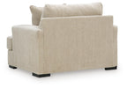 Lofwood chair and a half in beige upholstered fabric with wide arms and black legs