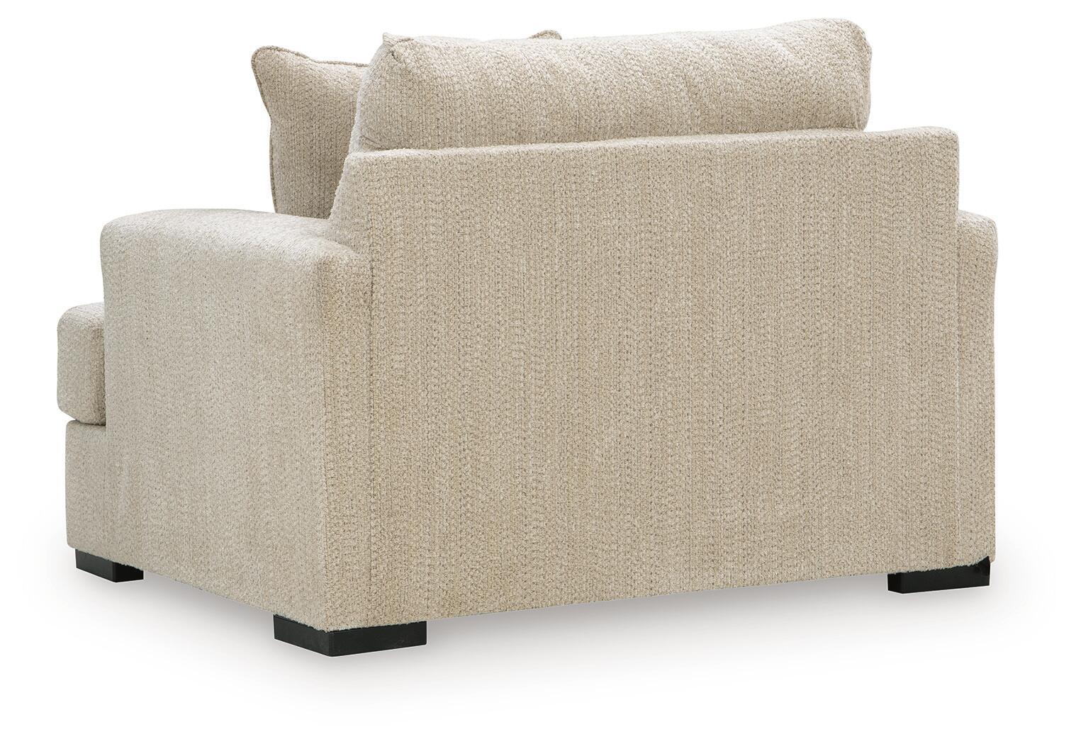 Lofwood chair and a half in beige upholstered fabric with wide arms and black legs