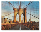 Framed wall art print of Brooklyn Bridge with blue sky and amber bridge structure
