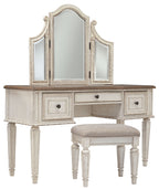 White vanity desk with arched mirror and two drawer cabinets, plus beige upholstered stool