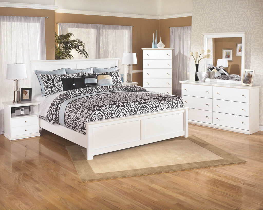 White one-drawer night stand with open shelf and round drawer knob in bedroom