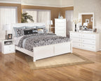 White one-drawer night stand with open shelf and round drawer knob in bedroom