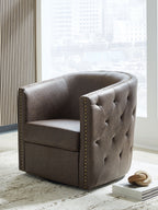 Brown swivel accent chair with tufted back, cushioned seat, and gold nailhead trim