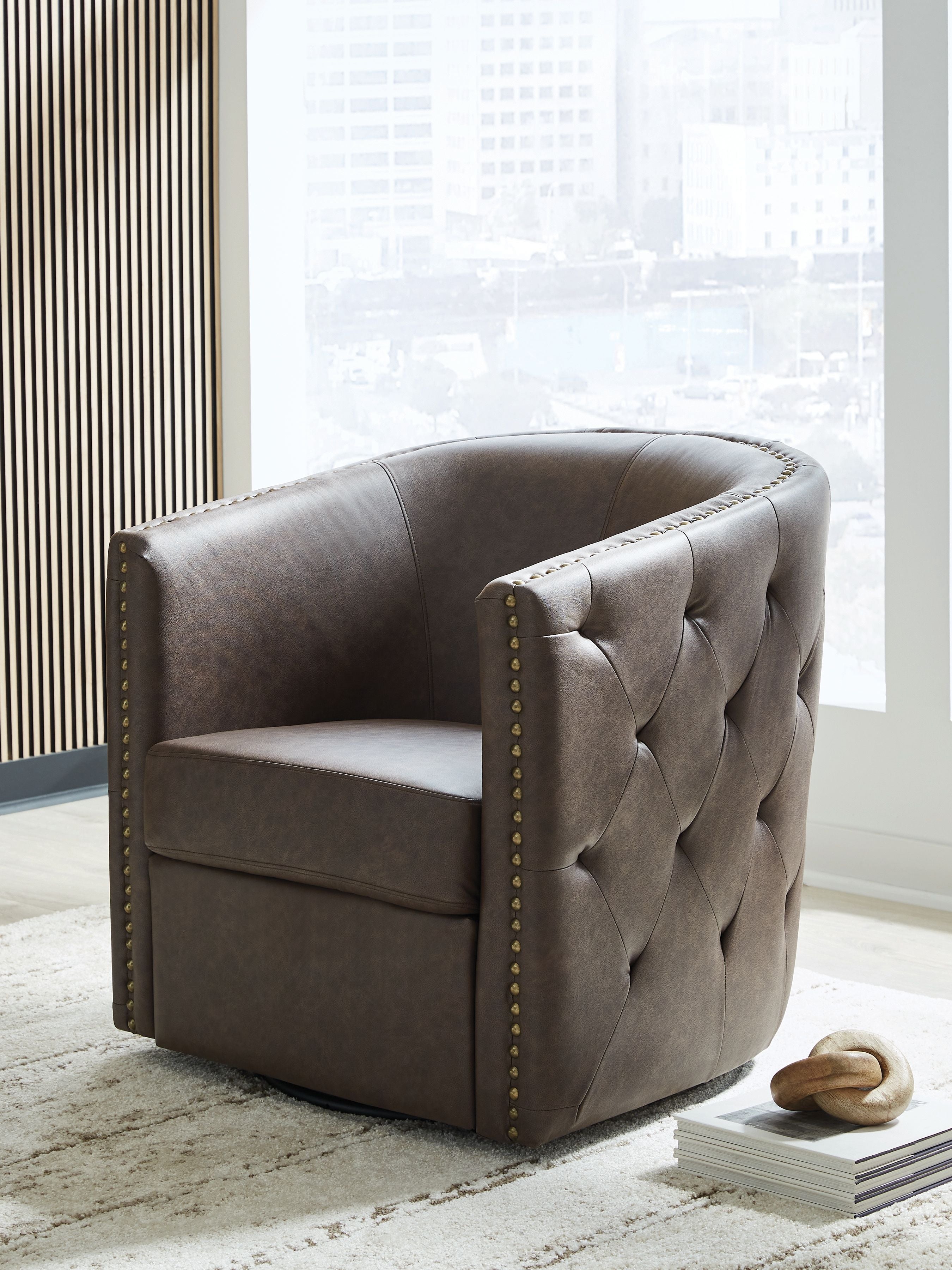 Brown swivel accent chair with tufted back, cushioned seat, and gold nailhead trim
