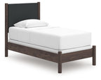 Upholstered panel bed with white mattress, dark gray headboard, and dark brown wood frame