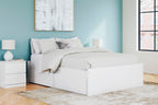 White platform bed with two side drawers, slat base, and bed pillows
