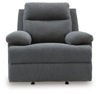 Dark gray reclining armchair with rounded arm pads, tall back cushion, and black feet