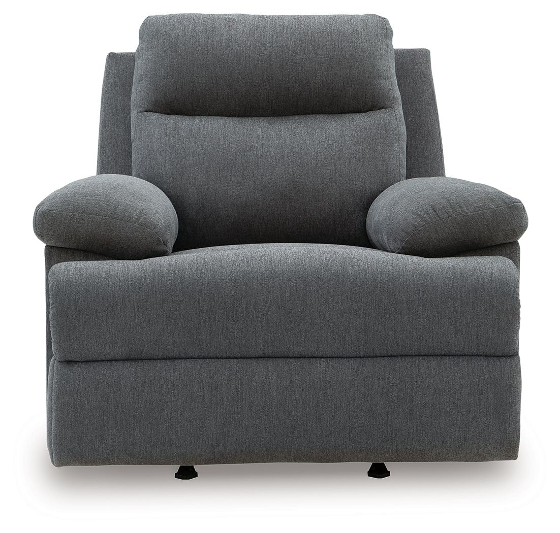 Dark gray reclining armchair with rounded arm pads, tall back cushion, and black feet