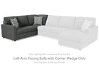 Charcoal sectional sofa with corner wedge, left-arm facing, and patterned throw pillows