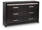 Black six-drawer dresser with six silver bar handles and patterned top trim