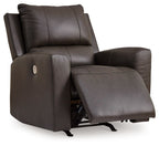 Dark brown power rocker recliner with extended footrest and cushioned armchair design