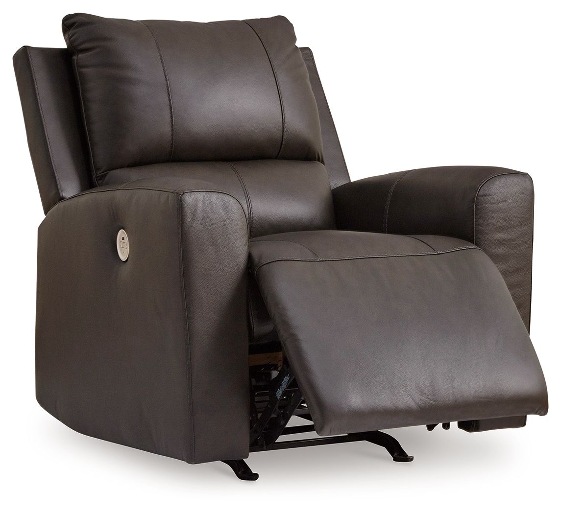 Dark brown power rocker recliner with extended footrest and cushioned armchair design