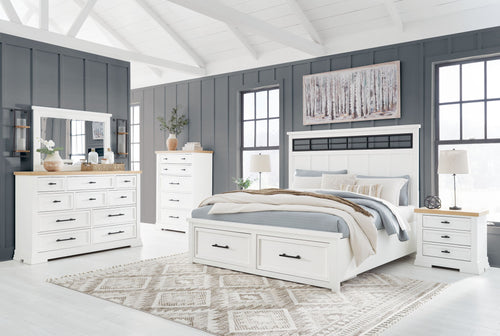 White bedroom set with panel storage dresser, mirror, and bed