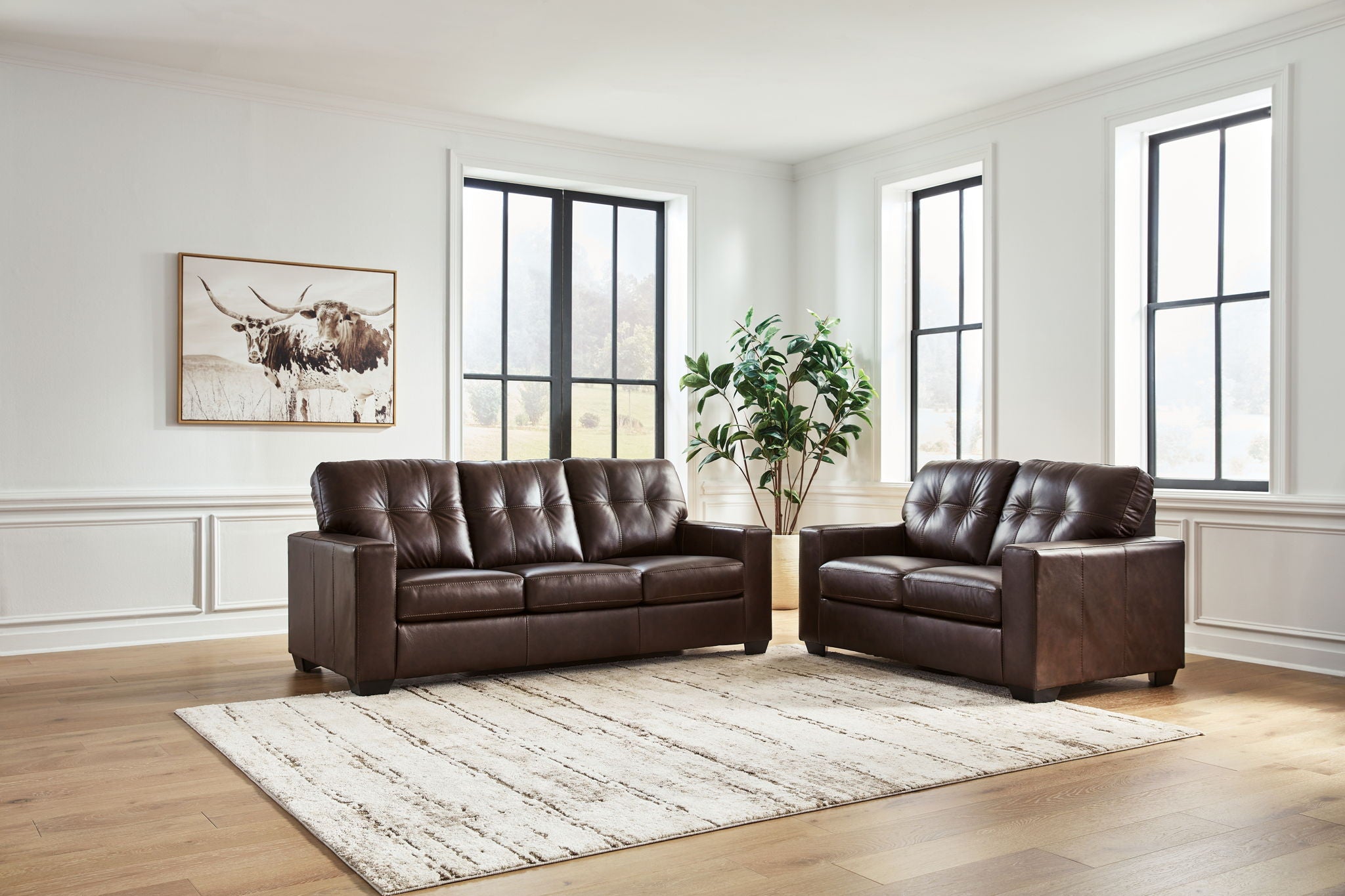 Dark brown upholstered sofa set with two-seat sofa and armchair, front view