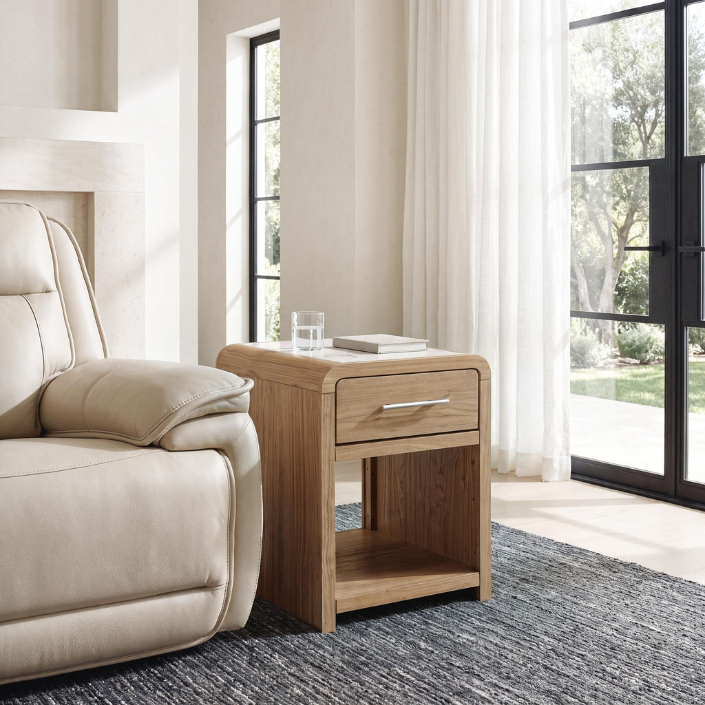 Light brown rectangular end table with drawer and open shelf, curved corners